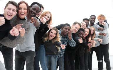 Wall Mural - close-up . team of happy young people pointing at you