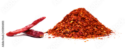 Fotomural Red hot chilies with powder over white background.