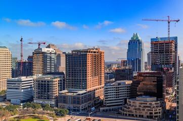 Wall Mural - Modern office buildings of tech firms downtown with the famous Frost Bank Tower in the background in Austin, Texas, USA