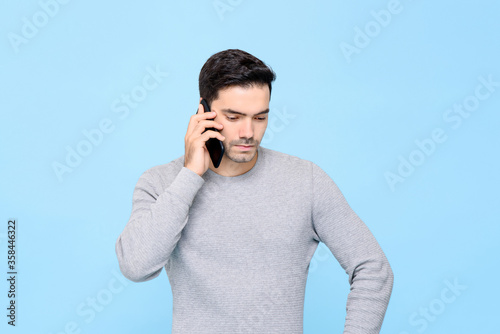 Fotografía Portrait of serious and upset handsome Caucasian man calling on cellphone with u