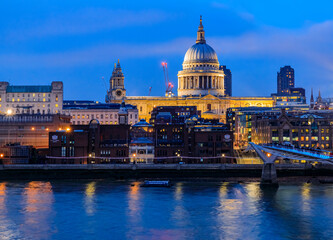 Canvas Print - View of the famous St. Paul's Cathedral across the river Thames with Millennium Bridge in London, England