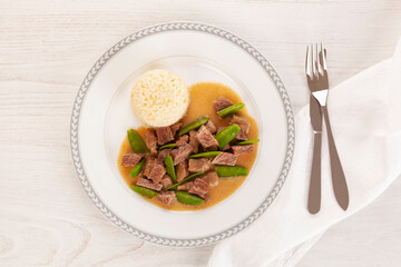 Canvas Print - Beef meat stewed with baby peas.