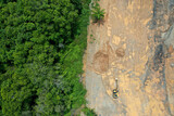 Fototapeta  - Environmental damage. Deforestation and logging. Aerial photo of forest cut down causing climate change 