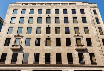 Canvas Print - Low angle shot of modern buildings with glass windows in London