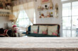 © qOppi - Empty wooden table space platform and blurred restaurant or coffee shop background for product display montage.