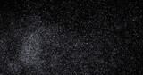 Fototapeta Tęcza - abstract Flying dust particles on a black background