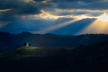 Church lit by a mystical sun rays. Christianity as a way of life.