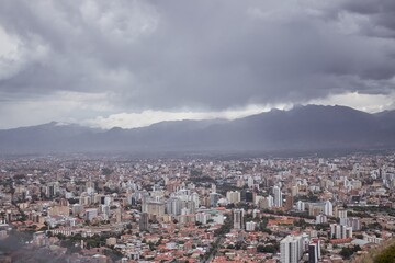 Poster - Aerial shot of a cityscape full of buildings and houses on a cloudy weather