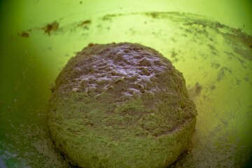 Sticker - High angle shot of kneaded dough on a yellow bowl