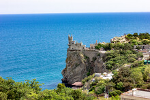 Crimea, Yalta. View Of The Castle "Swallow's Nest". Tourism In The Crimea. The Rock On Which The Castle Stands.