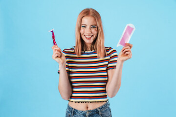 Sticker - Image of beautiful woman laughing while holding razor and wax strip