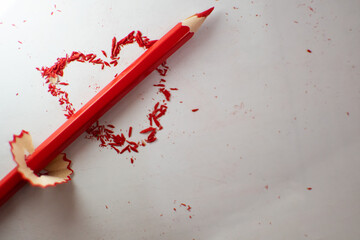 Wall Mural - colored pencil shavings on the vivid white bright beautiful background red heart