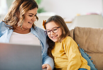 laptop computer education mother children daughter girl familiy childhood home child parent