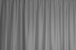 Grey curtain interior textile element close up background