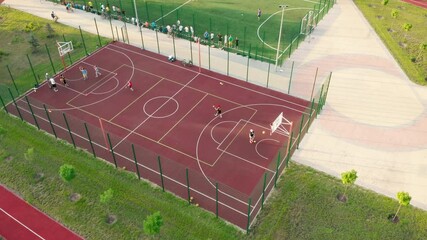 Wall Mural - Aerial view. Park with a football field and a training platform. City park with paths and green trees. Sports area