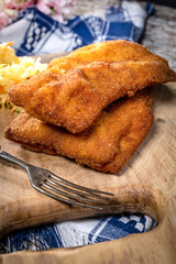 Two fried cod fillet pieces.