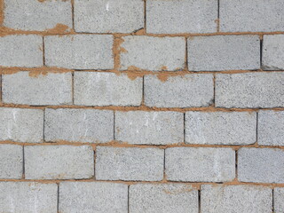 Gray exposed concrete brick wall textured background