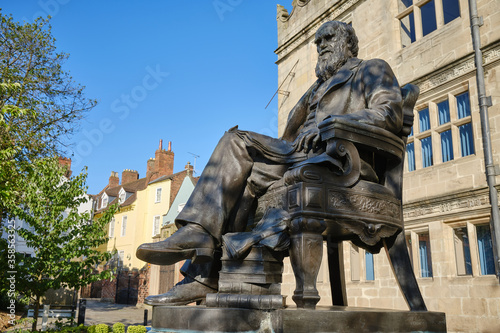statue of Charles Darwin outside his old school building in Shrewsbury, Shropshire, UK