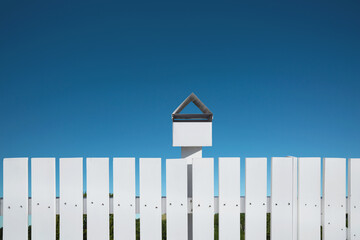 White fences with mailbox and blue sky, Clipping path.