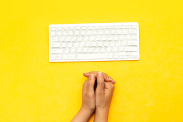 Wall Mural - Modern aluminum computer keyboard isolated on yellow background