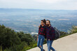 © BullRun - Beautiful young couple enjoying a hike together, couple of hikers walking down a hiking trail