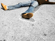 © MDBPIXS - Man lying in dead man chalk outline on concrete