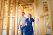 © leszekglasner - Fascinated couple walking in their new house under construction, dreams come true