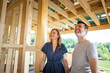 © leszekglasner - Couple make their dreams of building their own home come true visiting house under construction