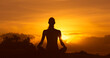 © kieferpix - silhouette of a woman meditating in the sunset