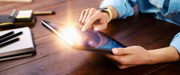 Woman pointing on digital tablet screen, chatting in social networks, meeting website, searching internet, sending sms, using text messenger or online banking. Close up photo