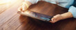© Rymden - Close up photo of female hands with a digital tablet