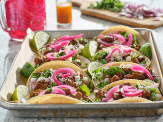 Wall Mural - tray of carne asada tacos topped with pickled onions and cojita cheese