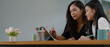 © bongkarn - Mother and daughter homeschooling with digital tablet on wooden worktable in living room