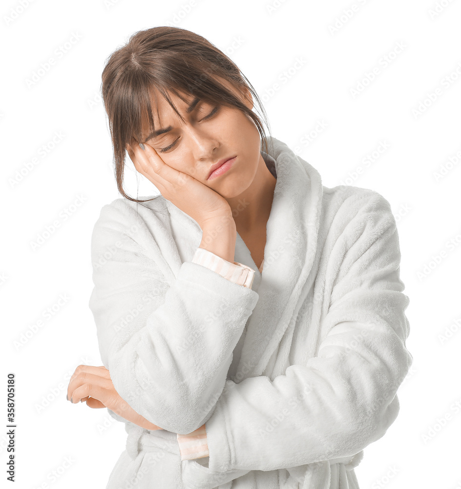 Young woman suffering from sleep deprivation on white background