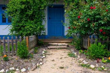 Wall Mural - country house with flowers and trees in the yard