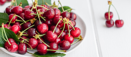 Fresh delicious red bright cherry berries torn in the summer garden