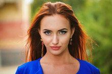 Closeup Portrait Of Pretty Young Red Head Girl On Street In City. Beauty Makeup