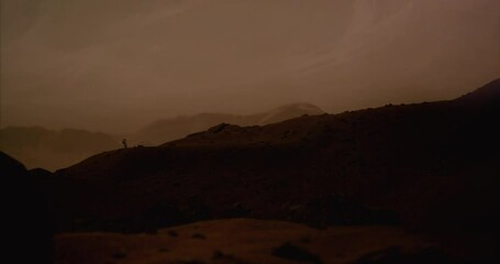 Wall Mural - lonely astronaut walking on a surface of a red rocky planet. mars colonization concept. dust effect 
