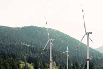  Alternative energy source. Wind turbines and mountains outdoors