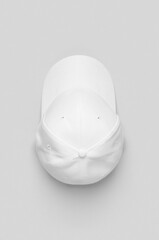 Canvas Print - White baseball cap mockup on a grey background.