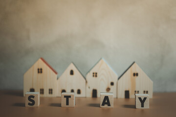 Poster - Wooden house with word stay. Safe home for safe life.