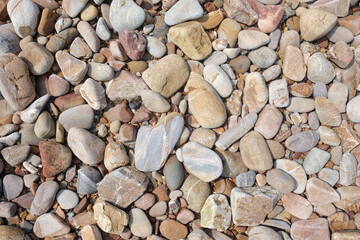 Seashore scree or Pebbled beach background.