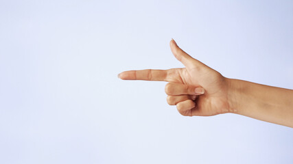 woman hand is pointing at something or someone isolated on white background. closeup