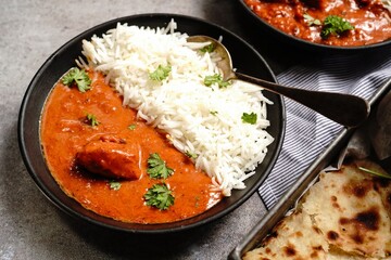 Wall Mural - Creamy Butter Chicken/Murgh Makhani served with Roti and Basmati rice