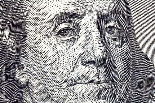 Cuadros en Lienzo Macro close up of Ben Franklin on the US $100 dollar bill.