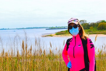 young woman wearing mask and gloves