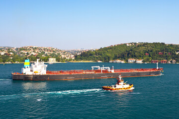 Wall Mural - Crude oil tanker with a fire boat sailing in straits, Turkey