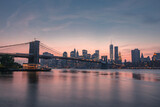 Fototapeta  - Brooklyn Bridge and Manhattan Skyline at sunset