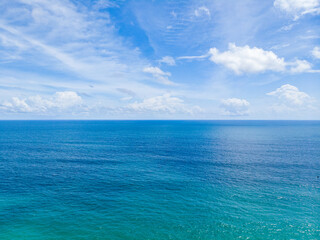 Wall Mural - Tropical island background concept. Bright and colorful oceand and sky in sunny day.