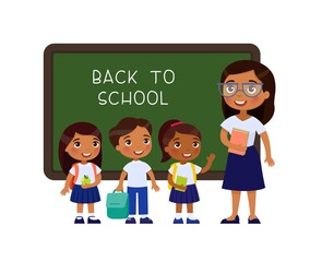 Wall Mural - Teacher greeting pupils in classroom flat vector illustration. Boys and girls dressed in school uniform and female teacher pointing at blackboard cartoon characters. Primary students back to school